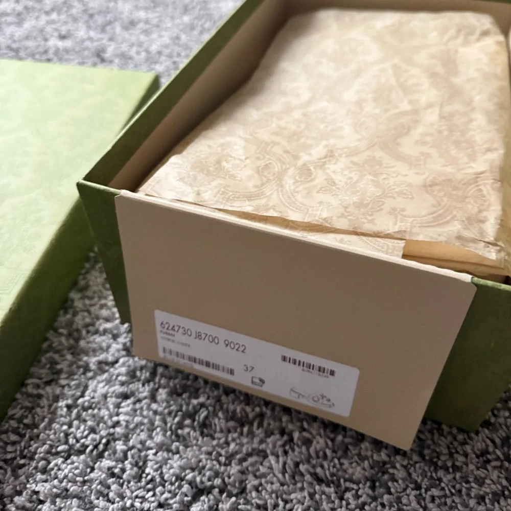 Gucci Cream Embossed Logo Slide Sandals - Picture 6 of 16